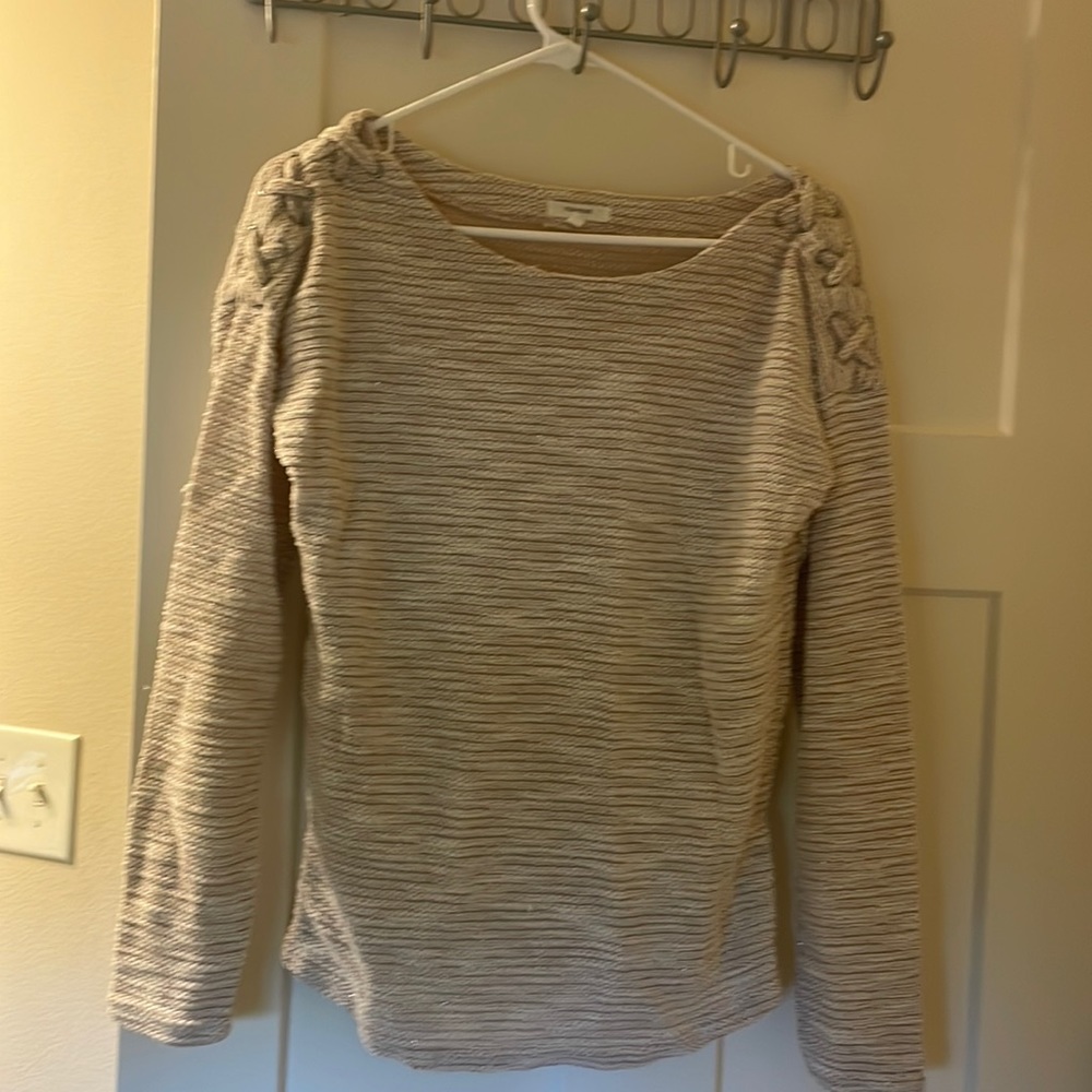 Tan Maurice’s brand sweater.